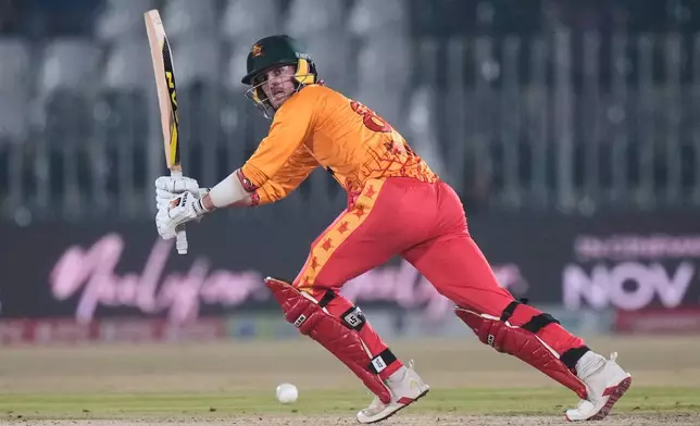 Zimbabwe's Brian Bennett plays a shot during the tri-series T20 cricket match between Pakistan and Zimbabwe, in Rawalpindi, Pakistan, Tuesday, Nov. 18, 2025. (AP Photo/Anjum Naveed)