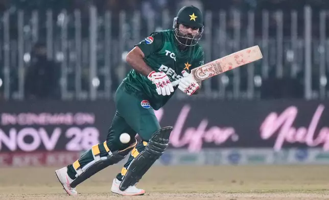 Pakistan's Fakhar Zaman plays a shot during the tri-series T20 cricket match between Pakistan and Zimbabwe, in Rawalpindi, Pakistan, Tuesday, Nov. 18, 2025. (AP Photo/Anjum Naveed)