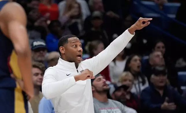 New Orleans Pelicans head coach Willie Green calls out from the bench in the second half of an NBA basketball game against the Portland Trail Blazers, Wednesday, Nov. 12, 2025, in New Orleans. (AP Photo/Gerald Herbert)