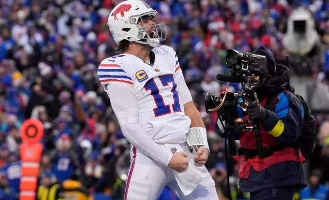 Buffalo Bills quarterback Josh Allen celebrates after scoring a touchdown against the Tampa Bay Buccaneers during the second half of an NFL football game, Sunday, Nov. 16, 2025, in Orchard Park, N.Y. (AP Photo/Carolyn Kaster)
