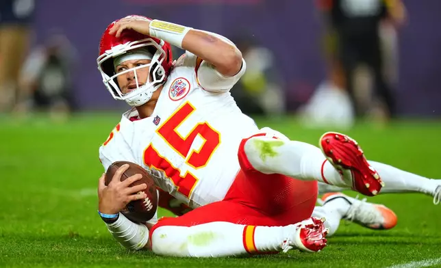 Kansas City Chiefs quarterback Patrick Mahomes (15) reacts after being sacked during the second half an NFL football game against the Denver Broncos Sunday, Nov. 16, 2025, in Denver. (AP Photo/Jack Dempsey)