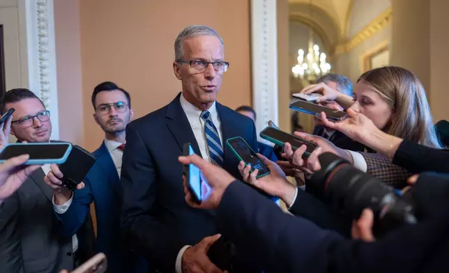 Speaking to reporters, Senate Majority Leader John Thune, R-S.D., responds to Senate Democratic Leader Chuck Schumer to reopen the government if Republicans extend expiring health care subsidies for one year, at the Capitol in Washington, Friday, Nov. 7, 2025, day 38 of the government shutdown. (AP Photo/J. Scott Applewhite)