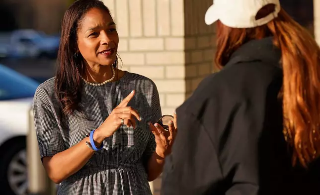 Virginia House of Delegates, Del.-elect, Nicole Cole, left, speaks with constituent Kaitlyn Sapp, at a convince store Thursday, Nov. 13, 2025, in Fredericksburg, Va. (Steve Helber)