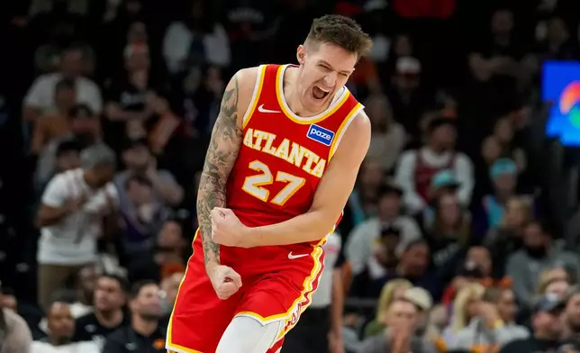 Atlanta Hawks guard Vit Krejci (27) celebrates hitting a 3-pointer against Phoenix Suns during the second half of an NBA basketball game in Phoenix, Sunday, Nov. 16, 2025. Atlanta won 124-122. (AP Photo/Darryl Webb)