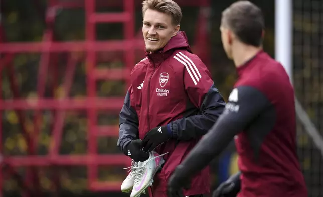 Arsenal's Martin Odegaard arrives for a team training session at the Sobha Realty Training Centre, London, Tuesday Nov. 25, 2025 ahead of Wednesday's Champions League match against Bayern Munich. (John Walton/PA via AP)