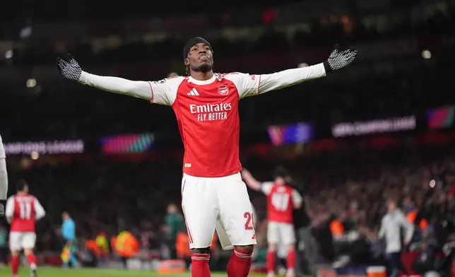 Arsenal's Noni Madueke celebrates after scoring his side's second goal during the Champions League opening phase soccer match between Arsenal and Bayern Munich in London, Wednesday, Nov. 26, 2025. (John Walton/PA via AP)