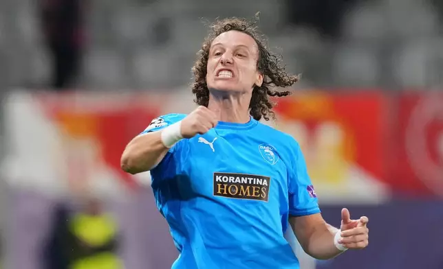 Pafos' David Luiz celebrates after scoring his side's opening goal during the Champions League opening phase soccer match between Pafos FC and AS Monaco in Limassol, Cyprus, Wednesday, Nov. 26, 2025. (AP Photo/Petros Karadjias)