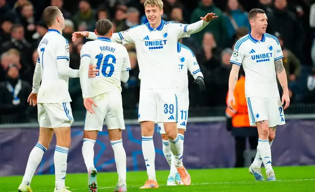 Copenhagen's Viktor Dadason, center, celebrates after scoring the opening goal during the Champions League opening phase soccer match between FC Copenhagen and Kairat Almaty in Copenhagen, Denmark, Wednesday, Nov. 26, 2025. (Ida Marie Odgaard/Ritzau Scanpix via AP)