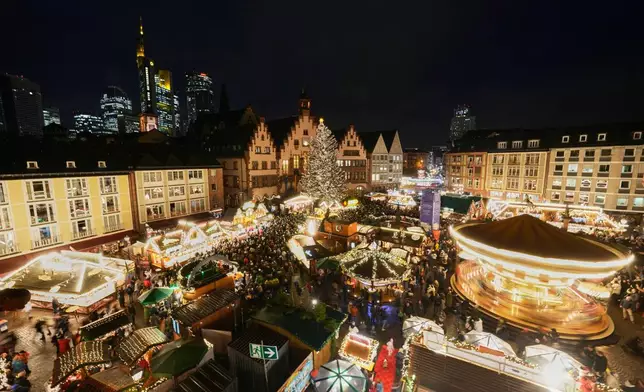 Lights illuminate the traditional Christmas Market in Frankfurt, Germany, Monday, Nov. 24, 2025. (AP Photo/Michael Probst)