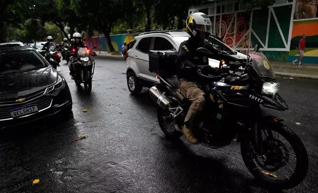 Police work ahead of the COP30 U.N. Climate Summit in Belem, Brazil, Friday, Oct. 31, 2025. (AP Photo/Eraldo Peres)