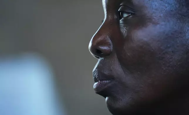 Deborah Reuben, a woman who was kidnapped with others in her community and later released after ransom was paid, listens to a question during an interview in Kaduna, northwestern, Nigeria, Thursday, Nov. 6, 2025. (AP Photo/Sunday Alamba)