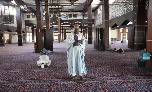 Idris Ishaq, an Imam who said he lost his grandson, cousin and elder brother in different attacks since 2022, prays at the central mosque in Kaduna northwestern, Nigeria, Nov. 6, 2025. (AP Photo/Sunday Alamba)