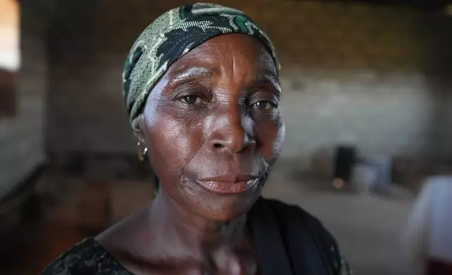 Tabitha Danladi, a 52-year-old mother of four who was kidnapped in June and later released and told to raise money to free her husband, is shown during an interview with The Associated Press in Kaduna, northwestern Nigeria, Nov. 6, 2025. "I've sold everything and they have been collecting ransoms but we don't know if he's still alive," said Danladi. (AP Photo/Sunday Alamba)