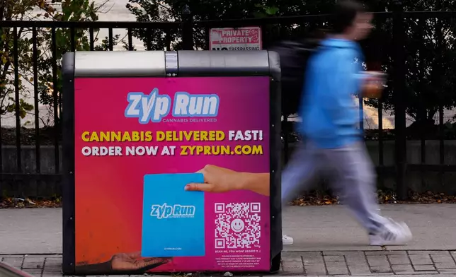 An advertisement for a cannabis delivery company is seen on a public trash bin Sunday, Nov. 16, 2025, in Boston. (AP Photo/Robert F. Bukaty)