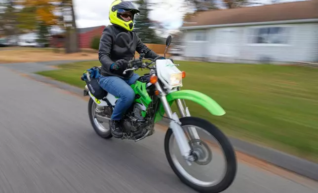 Anne Hassel, a former cannabis user, rides her motorcycle, Nov. 6, 2025, in Chicopee, Mass. (AP Photo/Robert F. Bukaty)