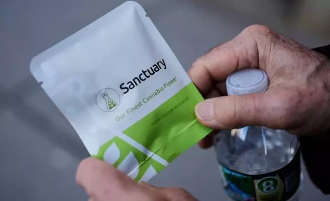 A customer holds a gram of cannabis purchased from a dispensary on Friday, Nov. 14, 2025, in Brookline, Mass. (AP Photo/Robert F. Bukaty)