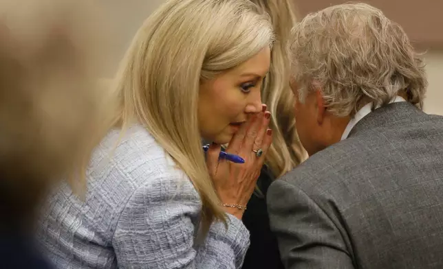 Abby Zwerner's attorney Diane Toscano confers with her colleague Jeffrey Breit during Zwerner's lawsuit Tuesday, Oct. 28, 2025, in Newport News, Va. (Stephen M. Katz/The Virginian-Pilot via AP, Pool)