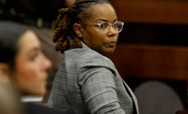 Former Richneck Elementary School assistant principal Ebony Parker looks back into the courtroom during Abby Zwerner's lawsuit against her Tuesday, Oct. 28, 2025, in Newport News, Va. (Stephen M. Katz/The Virginian-Pilot via AP, Pool)