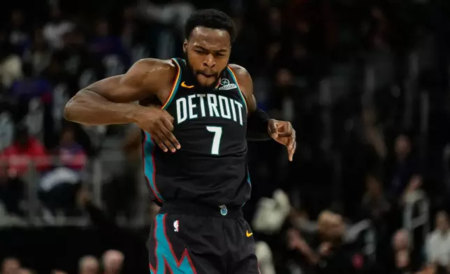 Detroit Pistons forward Paul Reed celebrates after making a three-point basket during the first half of an NBA basketball game against the Chicago Bulls, Wednesday, Nov. 12, 2025, in Detroit. (AP Photo/Ryan Sun)