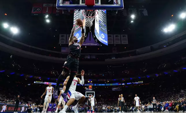 Philadelphia 76ers' Kelly Oubre Jr. goes up for a dunk during the first half of an NBA basketball game against the Detroit Pistons Sunday, Nov. 9, 2025, in Philadelphia. (AP Photo/Matt Slocum)