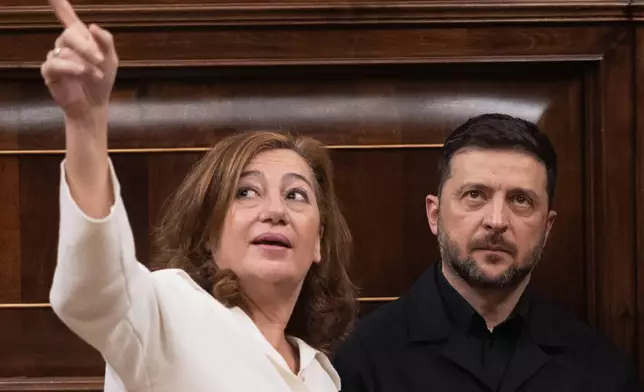 Ukrainian President Volodymyr Zelenskyy listens to the Congress President Francina Armengol during his visit to the Spanish parliament in Madrid, Spain, Tuesday, Nov. 18, 2025. (Eduardo Parra/Europa Press via AP)