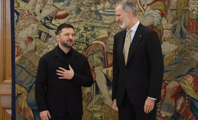 Ukrainian President Volodymyr Zelenskyy is received by Spain's King Felipe VI during a meeting in Madrid, Spain, Tuesday, Nov. 18, 2025. (Alejandro Martinez Velez/Europa Press via AP) **SPAIN OUT**