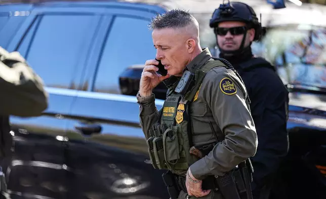 U.S. Border Patrol Commander at large Gregory Bovino takes a phone call, Monday, Nov. 17, 2025, in Charlotte, N.C. (AP Photo/Matt Kelley)