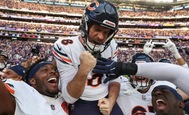 Chicago Bears place kicker Cairo Santos (8) celebrates after kicking the game-winning field goal against the Minnesota Vikings in an NFL football game, Sunday, Nov. 16, 2025, in Minneapolis. (AP Photo/Matt Krohn)