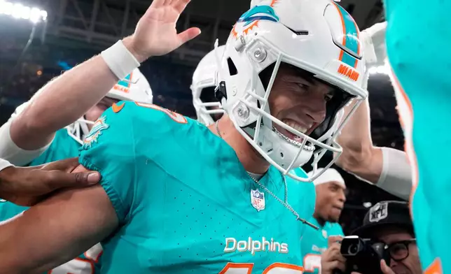 Miami Dolphins kicker Riley Patterson is congratulated after kicking the winning field goal in overtime of an NFL football game against the Washington Commanders in Madrid, Spain, on Sunday, Nov. 16, 2025. (Doug Benc/AP Content Services for the NFL)
