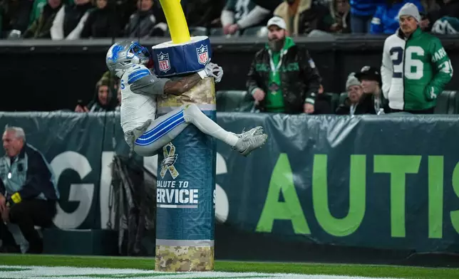 Detroit Lions wide receiver Jameson Williams celebrates scoring a touchdown during the first half of an NFL football game against the Philadelphia Eagles on Sunday, Nov. 16, 2025, in Philadelphia. (AP Photo/Matt Rourke)