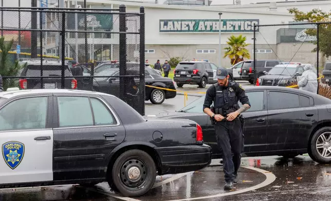 Police work the scene after a shooting at Laney College in Oakland, Calif., on Thursday, Nov. 13, 2025. (Santiago Mejia/San Francisco Chronicle via AP)