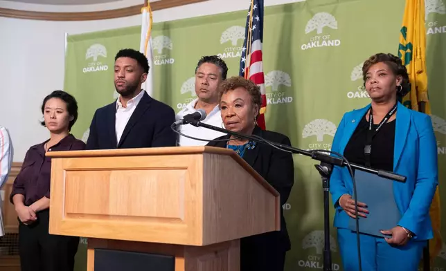 Oakland Mayor Barbara Lee, center, speaks during a press conference about public safety, a day after football coach John Beam was shot at Laney College, on Friday, Nov. 14, 2025, in Oakland, Calif. (AP Photo/Laure Andrillon)
