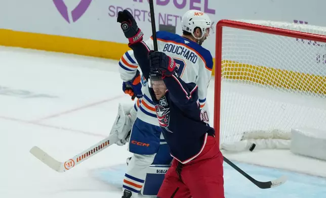 Columbus Blue Jackets right wing Mathieu Olivier (24) celebrates his goal in front of Edmonton Oilers center Curtis Lazar (20) in the first period of an NHL hockey game in Columbus, Thursday, Nov. 13, 2025. (AP Photo/Sue Ogrocki)