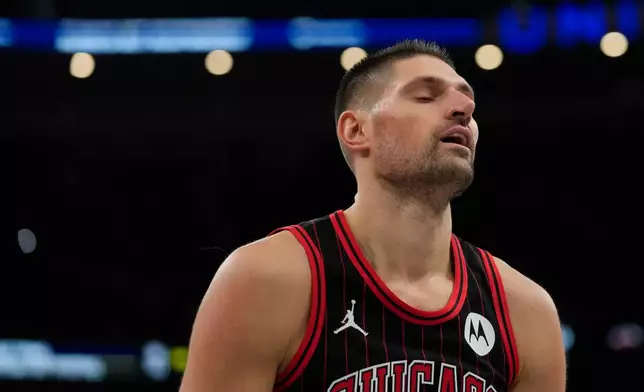 Chicago Bulls center Nikola Vucevic (9) reacts to a foul called on him during the first half of an NBA Cup basketball game against the Miami Heat, Friday, Nov. 21, 2025, in Chicago. (AP Photo/Erin Hooley)