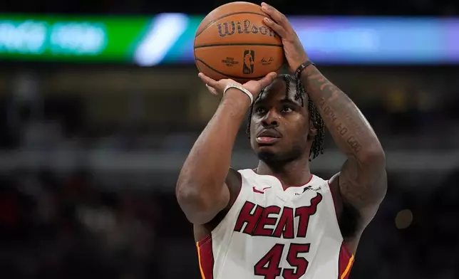 Miami Heat guard Davion Mitchell prepares to take a free throw during the first half of an NBA Cup basketball game against the Chicago Bulls, Friday, Nov. 21, 2025, in Chicago. (AP Photo/Erin Hooley)
