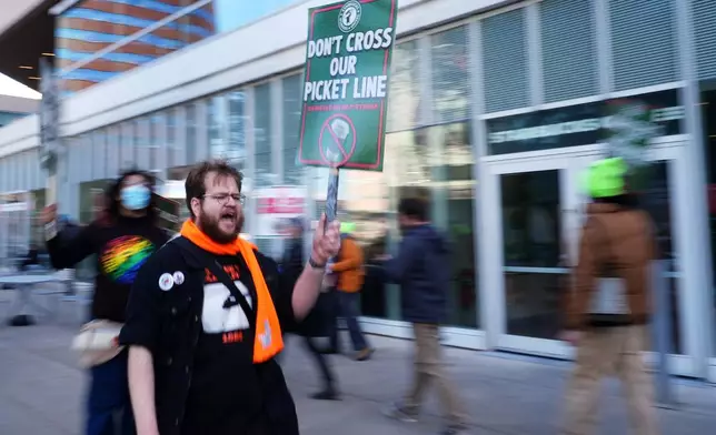 A protester chants during a picket outside a Starbucks, Thursday, Nov. 13, 2025, in Philadelphia. (AP Photo/Matt Slocum)
