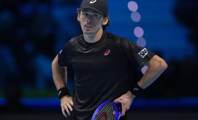 Australia's Alex de Minaur reacts during semifinal tennis match of the ATP World Tour Finals against Italy's Jannik Sinner, in Turin, Italy, Saturday, Nov. 15, 2025. (AP Photo/Antonio Calanni)
