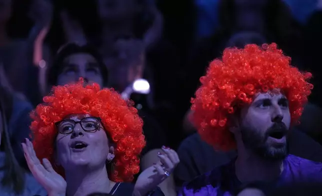 Italy's Jannik Sinner supporters watch his semifinal tennis match of the ATP World Tour Finals against Australia's Alex de Minaur, in Turin, Italy, Saturday, Nov. 15, 2025. (AP Photo/Antonio Calanni)