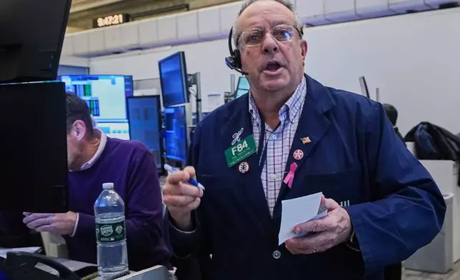 Options trader Phil Fracassini works on the floor of the New York Stock Exchange, Thursday, Nov. 20, 2025. (AP Photo/Richard Drew)