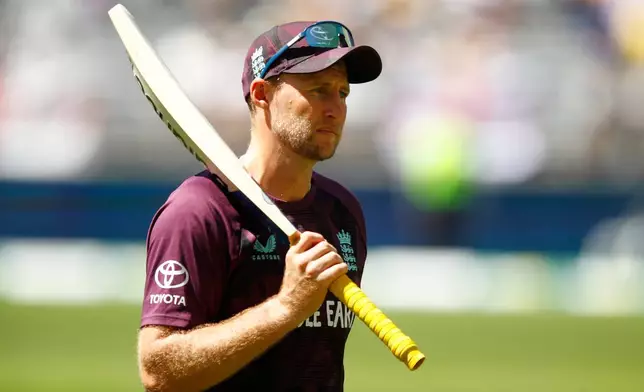 England's Joe Root warms up before the start of the first Ashes cricket test match between Australia and England in Perth, Friday, Nov. 21, 2025.(AP Photo/Gary Day)