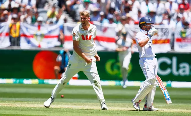 Australia's Cameron Green, left, celebrates the wicket of England's Ollie Pope during the first Ashes cricket test match between Australia and England in Perth, Friday, Nov. 21, 2025.(AP Photo/Gary Day)