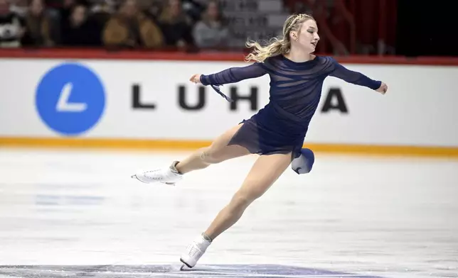 Amber Glenn, of the United States, performs in the women's free skating program at the ISU Grand Prix figure skating event in Helsinki, Finland, Saturday Nov. 22, 2025. (Mikko Stig/Lehtikuva via AP)