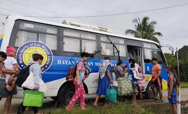 In this photo provided by the Philippine Coast Guard, residents are evacuated to safer grounds as Typhoon Kalmaegi nears the area of San Miguel, Leyte province, Philippines on Monday Nov. 3, 2025. (Philippine Coast Guard via AP)