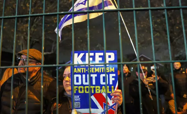 People demonstrate ahead of the Europa League soccer match between Aston Villa and Maccabi Tel Aviv in Birmingham, England, Thursday, Nov. 6, 2025. (AP Photo/Darren Staples)