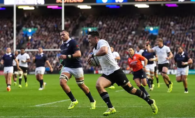 New Zealand's Will Jordan scores their side's second try during Rugby Union Autumn Series match between Scotland and New Zealand in Edinburgh, Scotland, Saturday, Nov. 8, 2025. (Andrew Milligan/PA via AP)