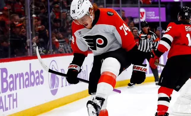 Philadelphia Flyers right wing Owen Tippett (74) reacts after scoring a goal against the New Jersey Devils during the first period of an NHL hockey game, Saturday, Nov. 29, 2025, in Newark, N.J. (AP Photo/Noah K. Murray)