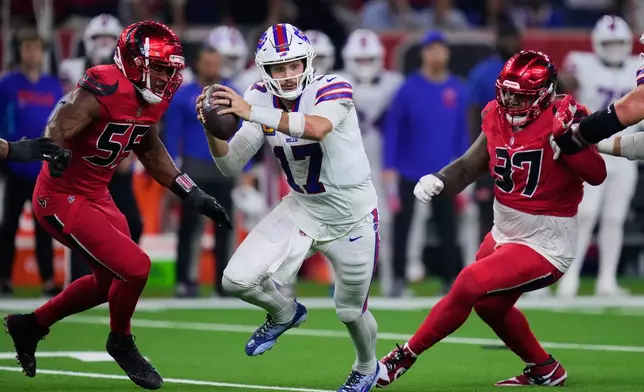 Buffalo Bills quarterback Josh Allen (17) is pressured out of the pocket by Houston Texans' Danielle Hunter (55) and Mario Edwards Jr. (97) in the second half of an NFL football game Thursday, Nov. 20, 2025, in Houston. (AP Photo/Eric Christian Smith)