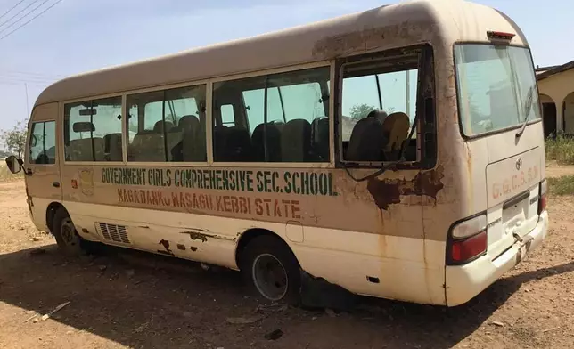 A view of the school bus of the Government Girls Comprehensive Secondary School, where gunmen on Monday attacked the school dormitory and abducted schoolgirls, is seen in Kebbi, Nigeria, Tuesday, Nov. 18, 2025. (AP Photo/Tunde Omolehin)