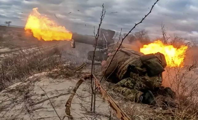 In this image made from video provided by Russian Defense Ministry Press Service on Friday, Nov. 7, 2025, a Russian army soldier fires a Fagot anti-tank missile system towards an Ukrainian position at an undisclosed location. (Russian Defense Ministry Press Service via AP)