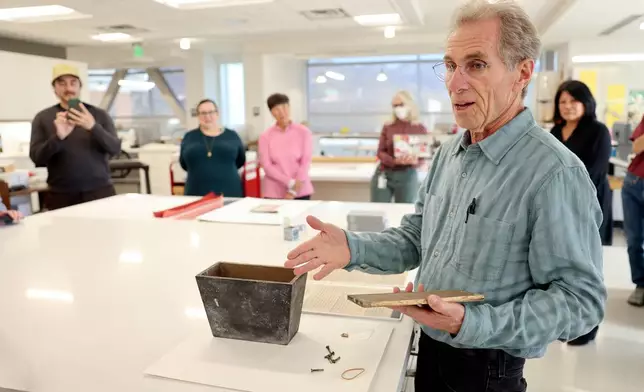 Randy Silverman, University of Utah Marriott Library head of preservation, talks about the uniqueness of a heavy metal box used for the Japanese Church of Christ's 100-year-old time capsule at the University of Utah Marriott Library Preservation Department in Salt Lake City, Monday, Oct. 20, 2025. (Kristin Murphy/The Deseret News via AP)